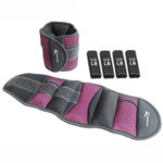 A set of fitness equipment, specifically a pair of adjustable ankle or wrist weights. The set includes one weight strap, one weight cuff, and four individual weight inserts labeled "1/2 LB" each. The weights are gray with pink mesh accents and Velcro closures.