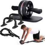 A set of fitness equipment including an ab roller, push-up bars, resistance bands, and a knee pad. A person is demonstrating the use of the ab roller.